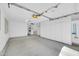 Finished garage with a washer and dryer, storage cabinets, and an automatic garage door at 17022 N Pinion Ln, Sun City, AZ 85373