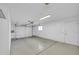 Spacious garage features an automatic door, peg board, and plenty of room for parking and storage at 17022 N Pinion Ln, Sun City, AZ 85373