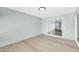 Enclosed patio with sliding glass door, light blue wood paneled walls, and ceiling light at 17022 N Pinion Ln, Sun City, AZ 85373