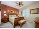 Relaxing bedroom boasts a decorative ceiling fan, neutral carpet, and bright natural light at 19212 N Tallowood Way, Surprise, AZ 85387
