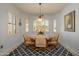 Cozy breakfast nook features bright light, an elegant rug, and seating for four at 19212 N Tallowood Way, Surprise, AZ 85387