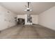 Spacious two car garage with tool organization and entry door to interior of home at 19212 N Tallowood Way, Surprise, AZ 85387