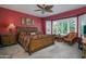 Spacious main bedroom with a large bay window and a ceiling fan at 19212 N Tallowood Way, Surprise, AZ 85387