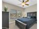 Comfortable bedroom featuring a ceiling fan, natural light from windows, and a dark-wood bed frame at 19700 N 76Th St # 2148, Scottsdale, AZ 85255