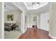 Welcoming foyer featuring hardwood floors, neutral paint, and views of the living room at 19700 N 76Th St # 2148, Scottsdale, AZ 85255