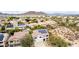 An aerial view of home showing solar panels, pool, backyard, and desert landscaping at 2046 E Avenida Del Sol --, Phoenix, AZ 85024