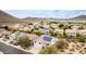 Aerial view showcasing community homes, landscaping, and solar panels with mountain views at 2046 E Avenida Del Sol --, Phoenix, AZ 85024
