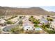 An aerial view showing the community homes with swimming pools, lush landscaping, and solar panels at 2046 E Avenida Del Sol --, Phoenix, AZ 85024