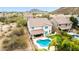 Aerial view of backyard oasis, a pristine blue swimming pool, vibrant lawn, and desert landscaping at 2046 E Avenida Del Sol --, Phoenix, AZ 85024