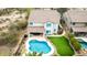 Aerial view of home featuring a pristine blue swimming pool and vibrant green lawn in a private backyard at 2046 E Avenida Del Sol --, Phoenix, AZ 85024