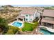 Expansive backyard view featuring pool, lawn, privacy fence, and a covered patio; a relaxing outdoor retreat at 2046 E Avenida Del Sol --, Phoenix, AZ 85024