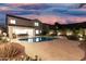 Beautiful backyard with pool, covered patio, desert landscaping, and an exterior dining set at 2046 E Avenida Del Sol --, Phoenix, AZ 85024