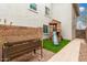 Backyard featuring a playset with slide, planter box, artificial turf, and decorative gravel at 2046 E Avenida Del Sol --, Phoenix, AZ 85024