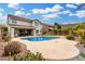 A spacious backyard featuring a pool, patio, and lush greenery, creating an inviting space for outdoor living at 2046 E Avenida Del Sol --, Phoenix, AZ 85024