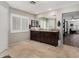 This bathroom offers a double vanity, large mirror, tile floors, and ensuite access to the bedroom at 2046 E Avenida Del Sol --, Phoenix, AZ 85024