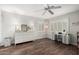 Bedroom with wood floors, dresser, and desk area featuring natural lighting at 2046 E Avenida Del Sol --, Phoenix, AZ 85024