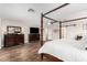 Large primary bedroom with a grand four-poster bed and en suite with barn door at 2046 E Avenida Del Sol --, Phoenix, AZ 85024