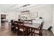 Elegant dining room features a large wood table, modern lighting, and stylish decor, creating a sophisticated dining experience at 2046 E Avenida Del Sol --, Phoenix, AZ 85024