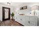 Bright foyer with decorative console table, stylish lamps, and a glimpse of the ornate front door sets an elegant tone at 2046 E Avenida Del Sol --, Phoenix, AZ 85024
