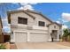 Inviting two-story home featuring a three-car garage and a well-maintained yard under a bright sky at 2046 E Avenida Del Sol --, Phoenix, AZ 85024
