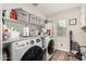 Laundry room with new washer and dryer on a light colored laminate flooring at 2046 E Avenida Del Sol --, Phoenix, AZ 85024