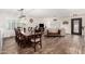 Spacious open-concept living and dining area with hardwood floors, ample natural light, and comfortable seating for relaxing at 2046 E Avenida Del Sol --, Phoenix, AZ 85024