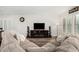 Inviting living room features a fireplace, entertainment center, and comfortable seating, perfect for relaxation and entertainment at 2046 E Avenida Del Sol --, Phoenix, AZ 85024