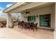Bright patio has an outdoor dining set with a ceiling fan, a built-in barbecue, and a barrel table at 2046 E Avenida Del Sol --, Phoenix, AZ 85024