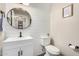 Stylish powder room features shiplap walls, a vessel sink, round mirror and modern fixtures at 2046 E Avenida Del Sol --, Phoenix, AZ 85024