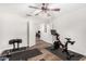 Bright workout room featuring open doorway, stationary bike, wood-look floors and white walls at 2046 E Avenida Del Sol --, Phoenix, AZ 85024