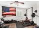 This workout room boasts a window, American flag, and weight training equipment at 2046 E Avenida Del Sol --, Phoenix, AZ 85024