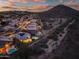 Aerial view of a desert neighborhood showcasing a home with a pool and solar panels at 22043 N 59Th Dr, Glendale, AZ 85310