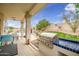 Outdoor living space with covered patio, stainless grill, blue tiled countertop and desert landscaping; great for entertaining at 22043 N 59Th Dr, Glendale, AZ 85310