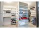 Spacious walk-in closet with built-in shelving for optimal organization and storage at 22043 N 59Th Dr, Glendale, AZ 85310