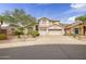 Charming two-story home with a three-car garage and desert landscaping at 22043 N 59Th Dr, Glendale, AZ 85310