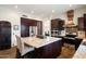 Gourmet kitchen with a large island, stainless steel appliances, and custom cabinets at 22043 N 59Th Dr, Glendale, AZ 85310