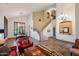 Grand living room with high ceilings, staircase, and lots of natural light at 22043 N 59Th Dr, Glendale, AZ 85310