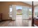 Bedroom featuring mountain views, sliding doors to the patio and natural light at 22043 N 59Th Dr, Glendale, AZ 85310