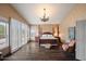 Spacious main bedroom with hardwood floors and a decorative chandelier at 22043 N 59Th Dr, Glendale, AZ 85310