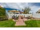 Charming backyard features a water feature and lush landscaping, offering a private oasis for relaxation at 2218 E Mallard Ct, Gilbert, AZ 85234