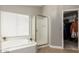 Clean bathroom featuring a tub and separate shower stall at 2218 E Mallard Ct, Gilbert, AZ 85234