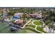Expansive clubhouse featuring a pool, tennis courts, lawns, and waterfront views at 2218 E Mallard Ct, Gilbert, AZ 85234