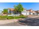 Charming two-story home featuring a well-manicured lawn and a spacious three-car garage at 2218 E Mallard Ct, Gilbert, AZ 85234