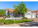 Lovely home boasting a well-maintained lawn, a decorative front wall, and a three-car garage at 2218 E Mallard Ct, Gilbert, AZ 85234