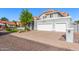Gorgeous home with a three-car garage and a beautiful front yard with mature landscaping at 2218 E Mallard Ct, Gilbert, AZ 85234