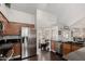 Functional kitchen with stainless steel refrigerator and dark countertops, conveniently situated near the dining area at 2218 E Mallard Ct, Gilbert, AZ 85234