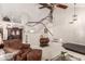 Spacious living room with vaulted ceiling, grand staircase, and comfortable seating area; perfect for relaxation and entertaining at 2218 E Mallard Ct, Gilbert, AZ 85234