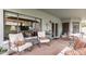 Inviting covered patio with comfortable seating and stylish decor, perfect for outdoor relaxation and entertaining at 2218 E Mallard Ct, Gilbert, AZ 85234