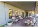 Relaxing covered patio area with comfortable seating and elegant design, ideal for enjoying outdoor living at 2218 E Mallard Ct, Gilbert, AZ 85234