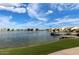 Waterfront view highlighting a lake with docks and lush landscaping at 2218 E Mallard Ct, Gilbert, AZ 85234